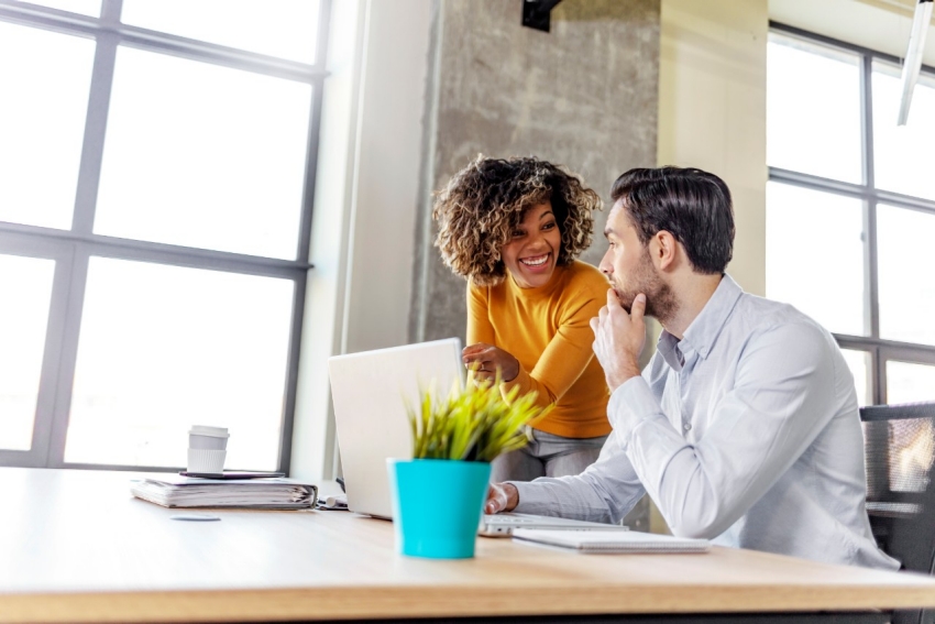 Woman sitting at a desk on a laptop Woman sitting at a desk on a laptop